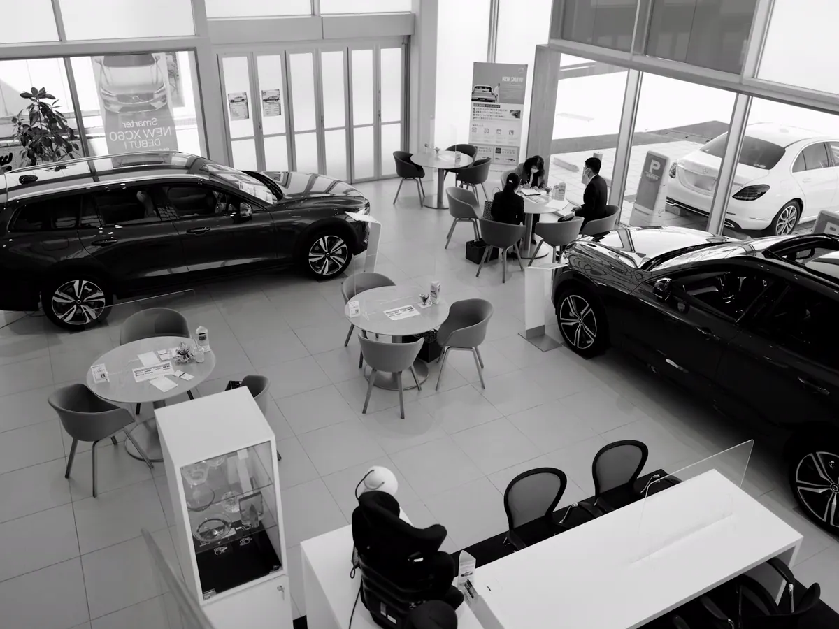 Vehicle showroom with customers being served